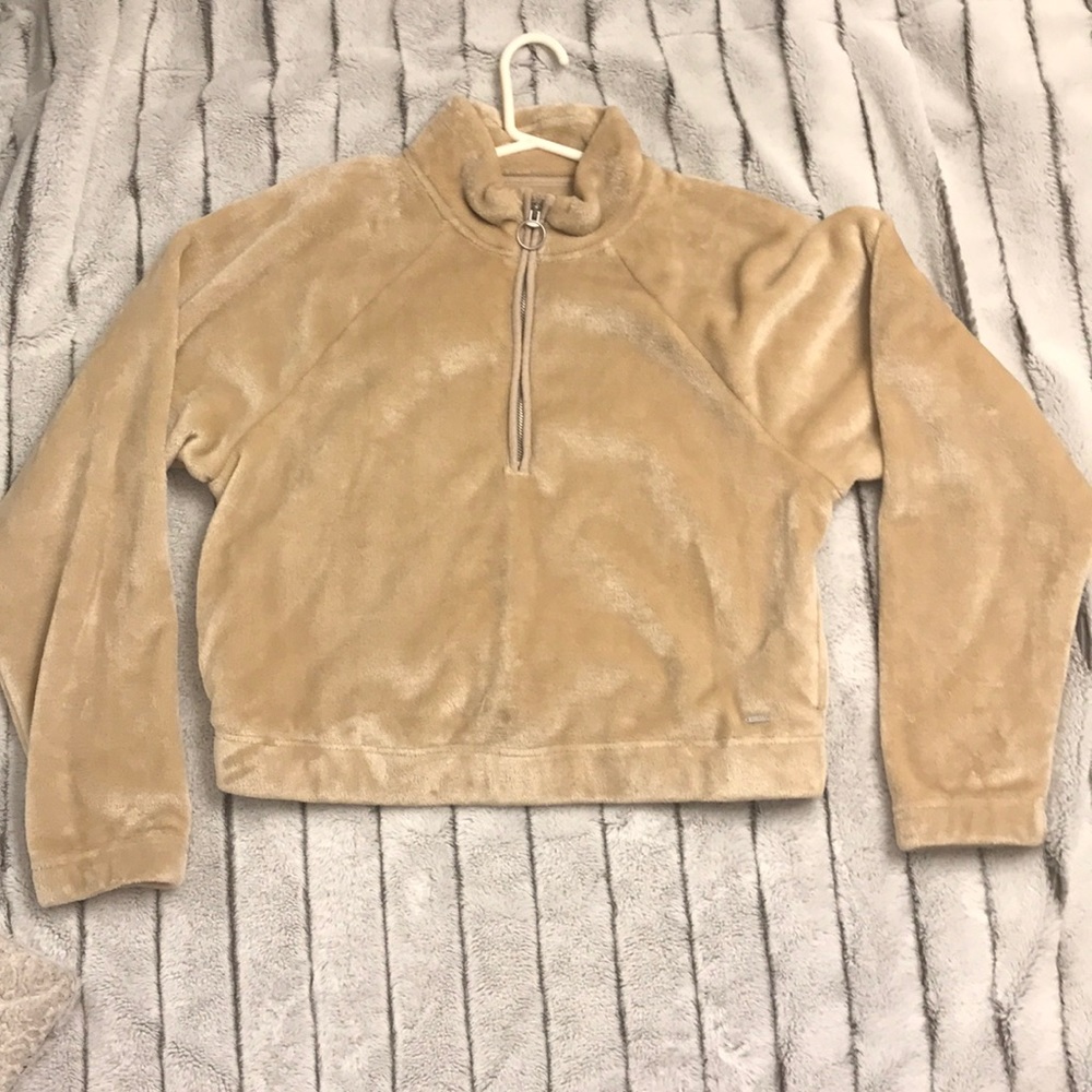 Cream color sweatshirt.